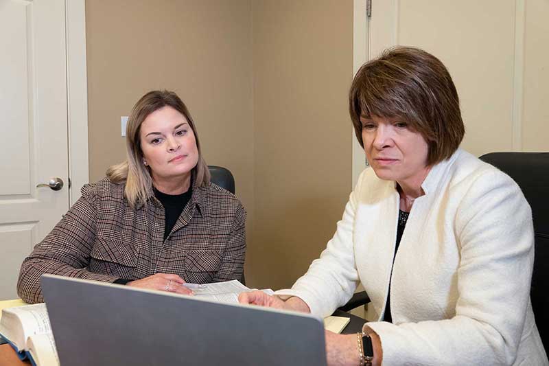 attorney Mary Beth Mock with administrative assistant Marianne Vaughn